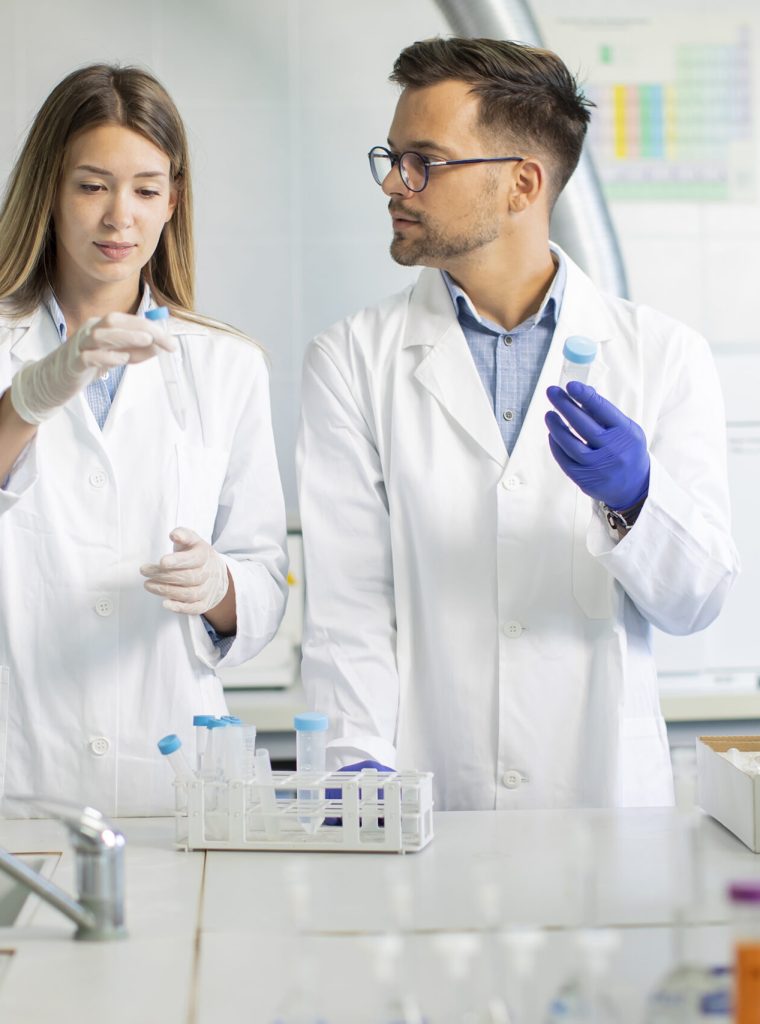 Young researchers analyzing chemical data in the laboratory
